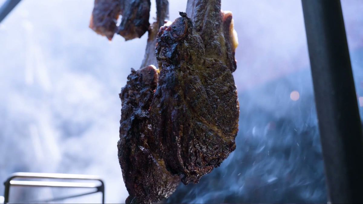 Senku Wagyu cooking over an open fire