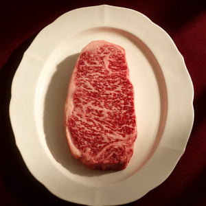 Muse Holiday Box from Standard Meat Club: marbled Wagyu NY strip on a white plate